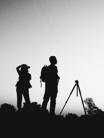 couple photographer in black and white silhouetteの写真素材