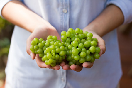 grape in woman hands 