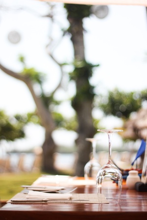 empty glass of vine on table with tree backgroundの写真素材