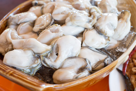 raw oyster served with spice side dishes in Thailand