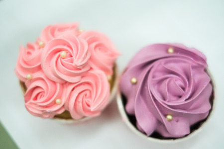 sweet pastel cupcakes with flower on top-shallow depth of fieldの写真素材