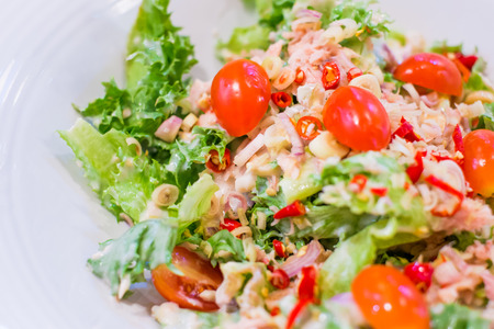 spicy Thai style tuna salad with herbs and spicesの写真素材