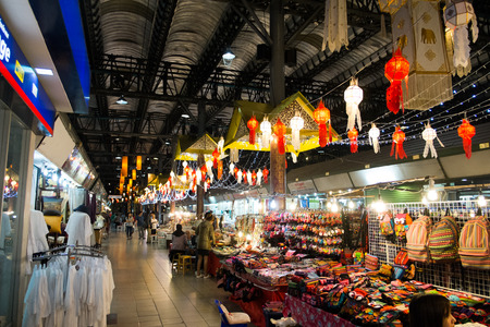 CHIANG MAI, THAILAND - JANUARY 21, 2015: Unidentified tourists enjoy shopping at Chiang Mai Night Bazaar, tourist attraction which is known for its handicrafts and portrait paintings and also jewelry, toys, clothing.のeditorial素材