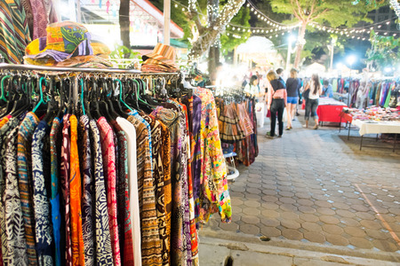 CHIANG MAI, THAILAND - JANUARY 21, 2015: Unidentified tourists enjoy shopping at Chiang Mai Night Bazaar, tourist attraction which is known for its handicrafts and portrait paintings and also jewelry, toys, clothing.のeditorial素材