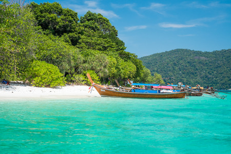 KOH ADANG, THAILAND - FEB 21 Crowded tourists and  a lot of local wooden boats during Chinese New Year 2015 at Adang Island  near Koh Lipe in  the southern of Thailand on February 21, 2015.のeditorial素材