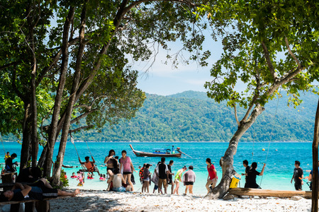 KOH ADANG, THAILAND - FEB 21 Crowded tourists and  a lot of local wooden boats during Chinese New Year 2015 at Adang Island  near Koh Lipe in  the southern of Thailand on February 21, 2015.のeditorial素材