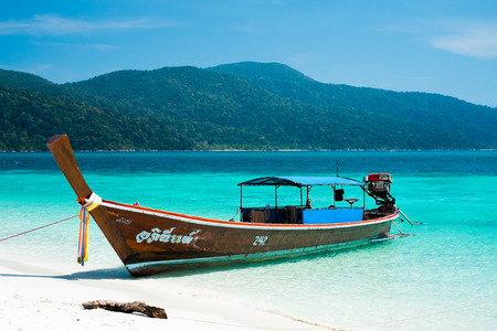 KOH ADANG, THAILAND - FEB 21 Crowded tourists and  a lot of local wooden boats during Chinese New Year 2015 at Adang Island  near Koh Lipe in  the southern of Thailand on February 21, 2015.のeditorial素材