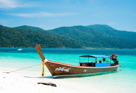 KOH ADANG, THAILAND - FEB 21 Crowded tourists and  a lot of local wooden boats during Chinese New Year 2015 at Adang Island  near Koh Lipe in  the southern of Thailand on February 21, 2015.のeditorial素材