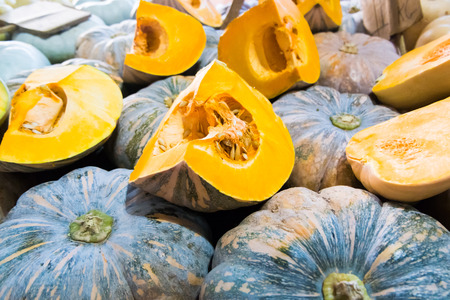 yellow pumpkin cut in piecesの写真素材