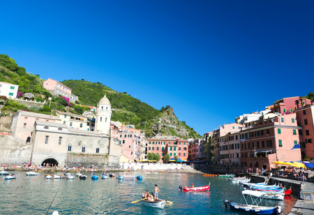 VERNAZZA, ITALY - JULY 16: Tourists enjoying summer activities on the beach on July 16, 2016 at Vernazza, Cinque Terre, Italy.のeditorial素材