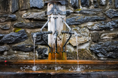 close up pf running water from fountain in Swiss - mineral waterの写真素材