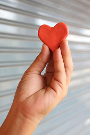 Hold red heartの写真素材