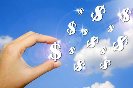 Hand and money symbol on blue sky backgroundの写真素材