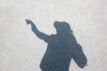 Shadow of human on the wallの写真素材