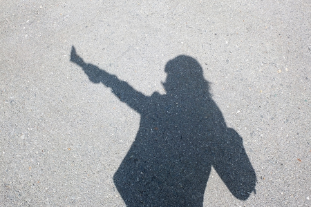 Shadow of human on the wallの写真素材