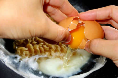 Cracked egg : Cooking conceptの写真素材