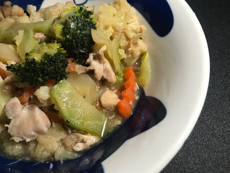 Fried Vegetables with Chicken and Broccoli in a Blue Bowlの写真素材