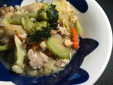 Stir Fried Vegetables with Chicken and Soy Sauce on Blue Plateの写真素材