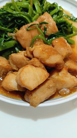 Stir Fried Garlic Chicken and Morning Gloryの写真素材