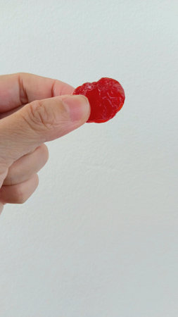 Dehydrated Tomato on Hand for Eating after Mealの写真素材