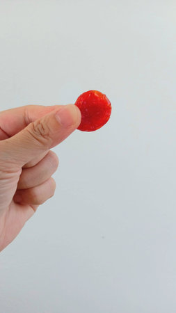 Dehydrated Tomato on Hand for Eating after Mealの写真素材