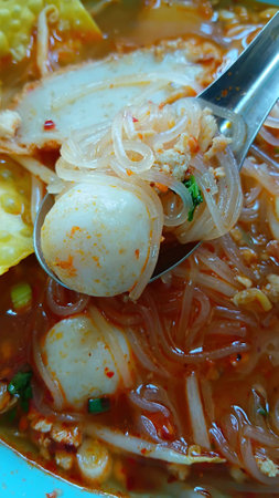 Tom Yum Noodles with Pork and Fish Ballsの写真素材