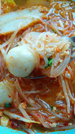 Tom Yum Noodles with Pork and Fish Ballsの写真素材
