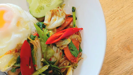 Stir Fried Vegetables with Basil Leaves and Fried Egg Recipeの写真素材