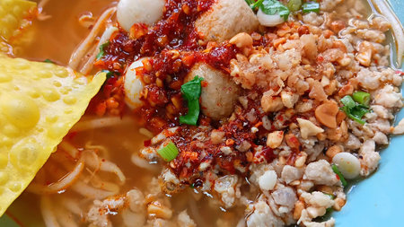 Tom Yum Noodles with Pork and Fish Ballsの写真素材