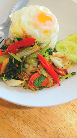 Stir Fried Vegetables with Basil Leaves and Fried Egg Recipeの写真素材