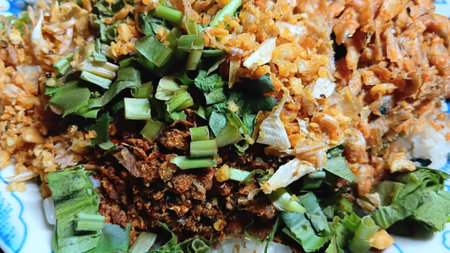 Fried Fish and Garlic with Chili Paste on Riceの写真素材