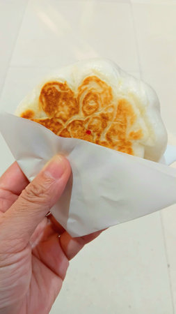 Fried Stuffed Bun on Handの写真素材