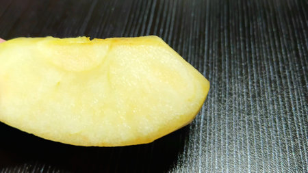 Fresh Apple Slice on Handの写真素材