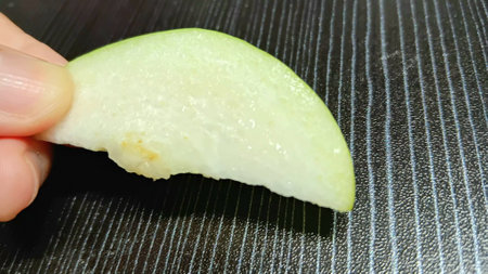 Fresh Guava Slice on Handの写真素材