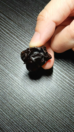Dried Plum on Hand for Healthyの写真素材