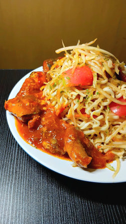 Spicy Instant Noodles with Papaya Salad and Canned Mackerel Fish Recipeの写真素材