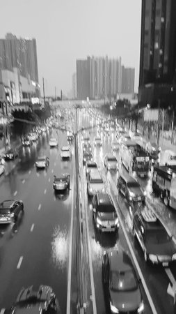 Blurred Rain and Traffic View as Black and White Backgroundの写真素材