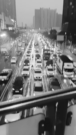 Blurred Rain and Traffic View as Black and White Backgroundの写真素材