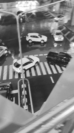 Blurred Rain and Traffic View as Black and White Backgroundの写真素材