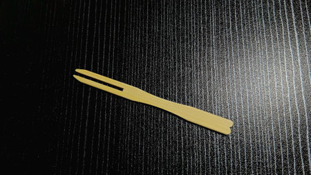 Tiny Wooden Fork for Toast and Fruitsの写真素材
