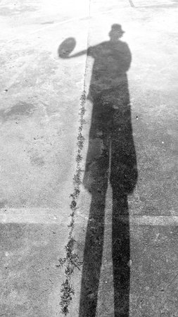 Shadow of Man on Basketball Court as Black and White Toneの写真素材