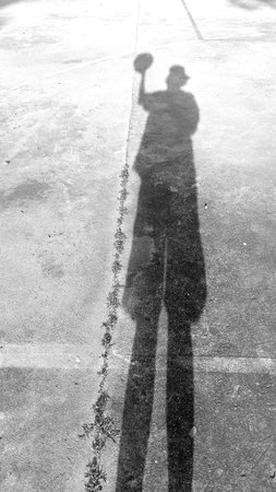 Shadow of Man on Basketball Court as Black and White Toneの写真素材