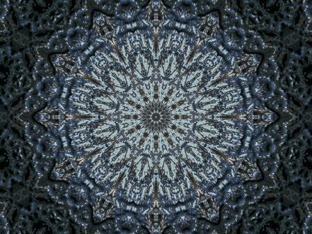 Kaleidoscope of vivid abstract pattern as looking through rough translucent glass. Selective focus.の写真素材