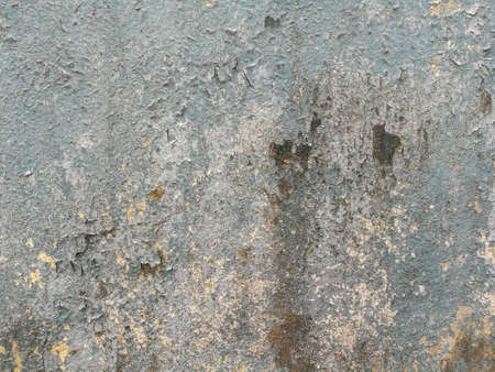 The texture of cracked blue color paints on the old cement wall.の写真素材