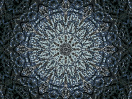 Kaleidoscope of vivid abstract pattern as looking through rough translucent glass. Selective focus.の写真素材