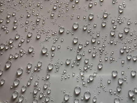 Pattern of water bubbles on white plastic box cover.の写真素材