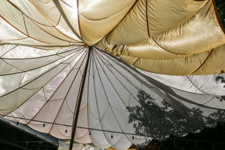 Translucent canvas roof with a center pole in the park.の写真素材