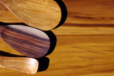 Wooden spoons on the wood table, natural background.の写真素材