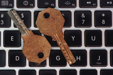 Old and rusty keys on laptop keyboard, computer security and password concept