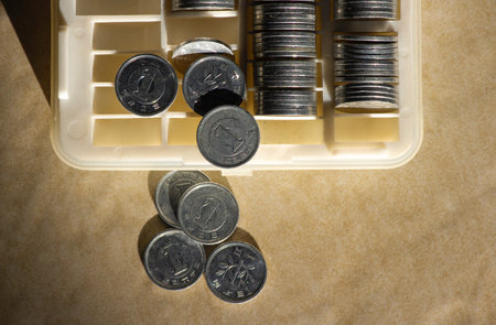 One Yen on the coin box, in shallow focus. Saving money concept, cash managementの写真素材